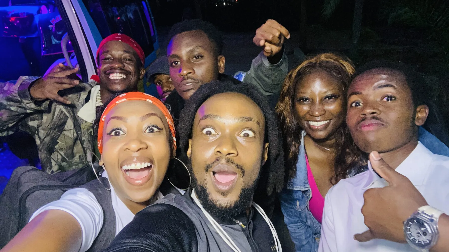 A cheerful group selfie with the MRX community after dark
